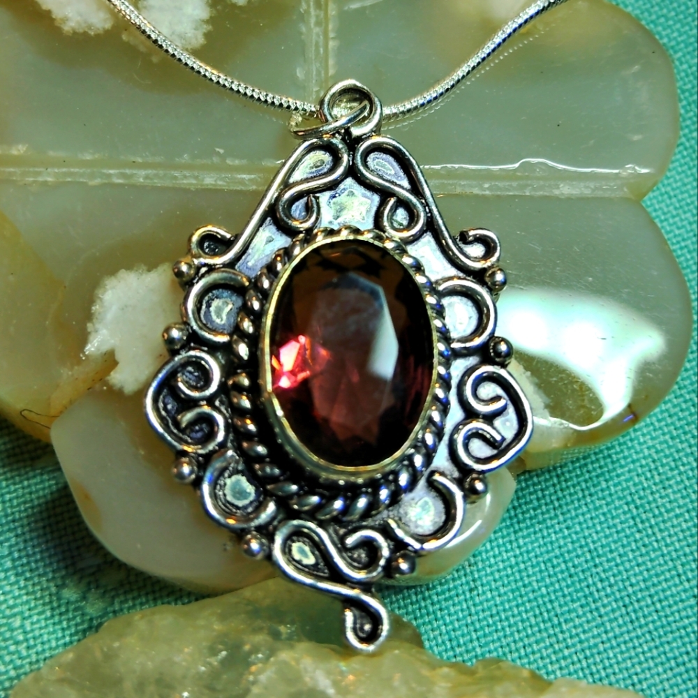 ELEGANT 18 IN STERLING CHAIN HOLDS A STERLING SILVER AFRICAN AMETHYST PENDANT.